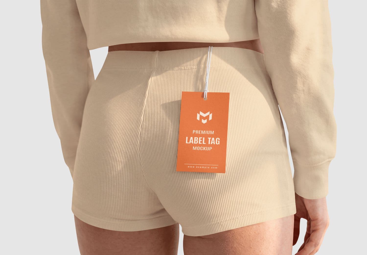 Realistic Clothing Hang Tag Mockup with Fashion Lifestyle Scene