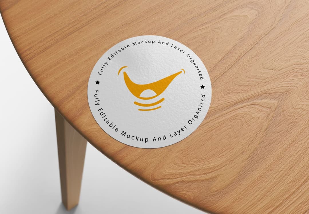 Realistic Circular Sticker Mockup on Wooden Table