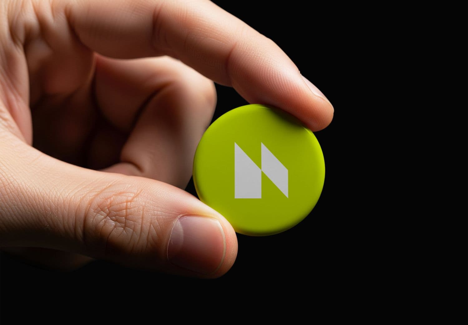 Hand Holding Orange Button Mockup