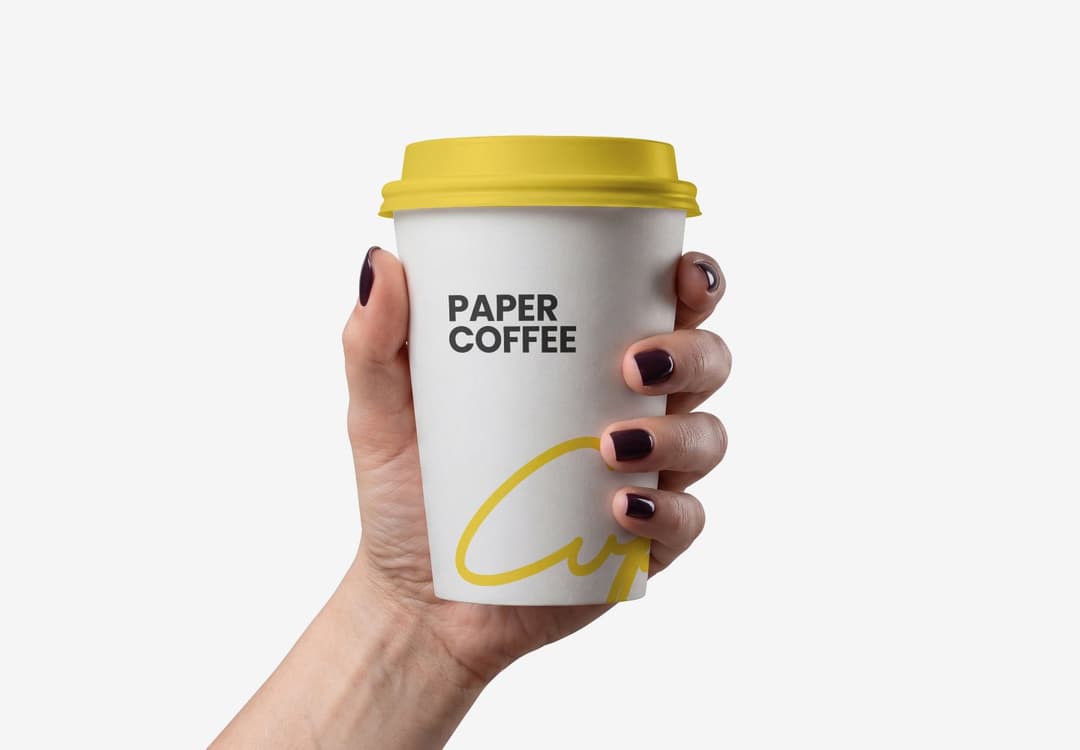 Female Hand Holding Paper Coffee Cup Mockup