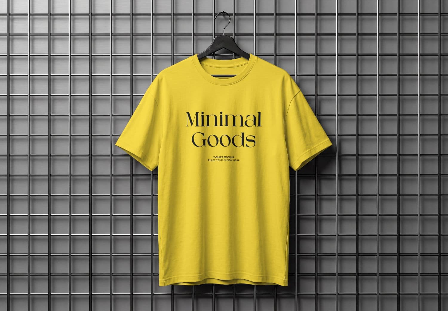 Yellow T-Shirt Mockup Hanging on Black Hanger and Metal Grid Wall