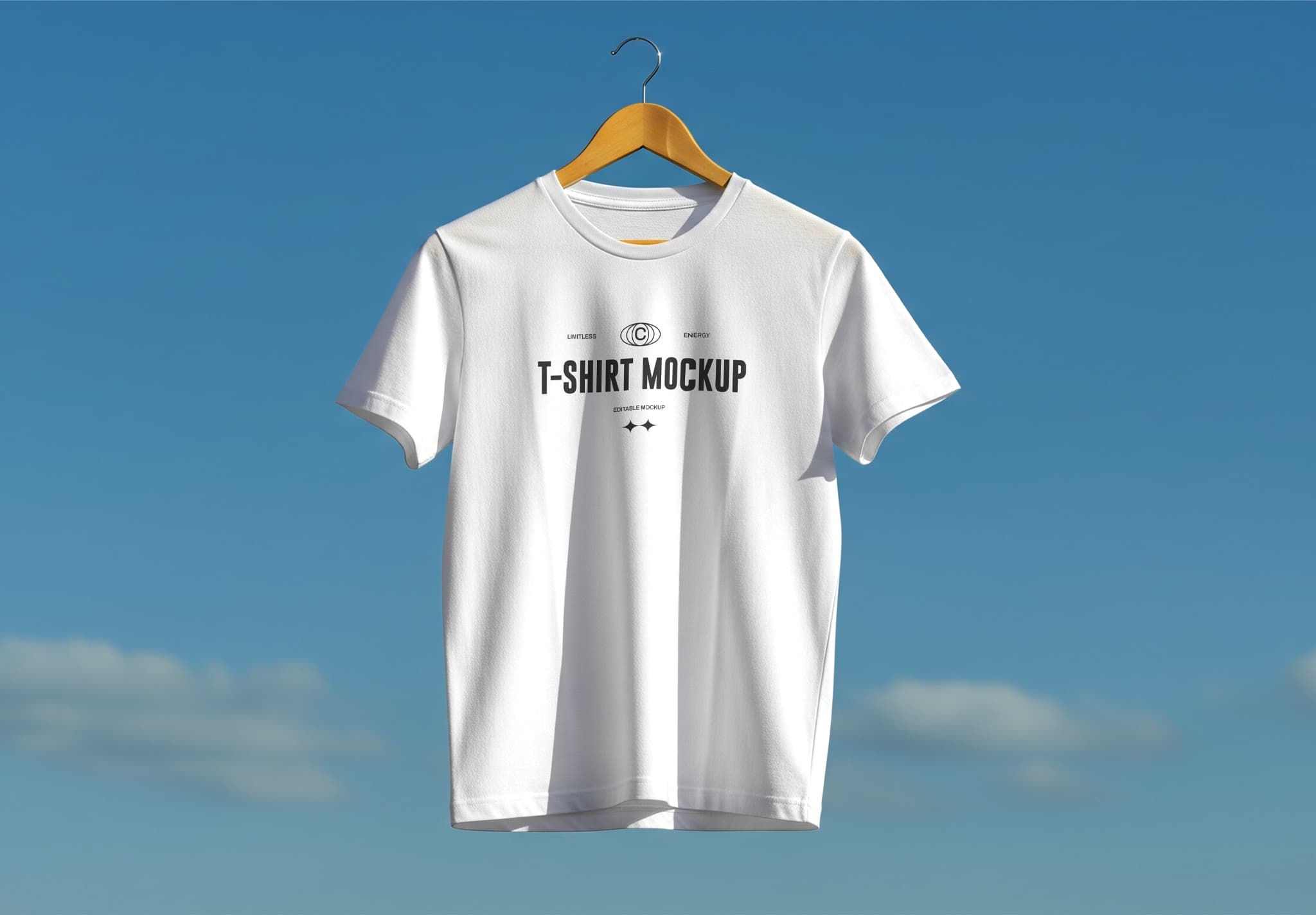 White T-Shirt Mockup Hanging on Wooden Hanger with Sky Background