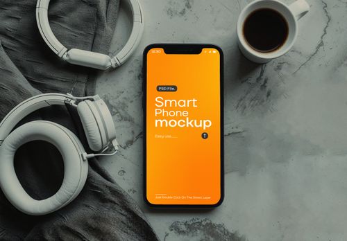 Flat Lay iPhone 15 Pro Mockup – Orange Screen with Headphones & Coffee